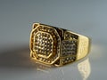 Closeup shot of a men's ring encrusted with diamonds isolated on a white surface