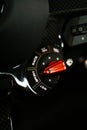 Closeup shot of the met black mode selector switch of a Ferrari 812 Superfast