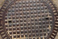 Closeup shot of a metal manhole cover, texture of a metal manhole cover