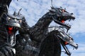 Closeup shot of a metal statue of a three-headed dragon