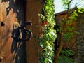 Closeup shot of a metallic door handle in the form of a dragon on an old door in Rupit, Spain Royalty Free Stock Photo