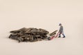 Closeup shot of a miniature labor figure on a pile of sunflower seeds Royalty Free Stock Photo