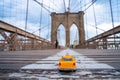 Closeup shot of a model taxi car on the Brooklyn Bridge in New York, USA