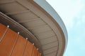 Closeup shot of a modern business building touching the fluffy cloudy sky Royalty Free Stock Photo