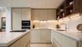 Closeup shot of modern minimalist kitchen featuring beige floortoceiling cabinetry and walnut wood open shelving with LED lighting