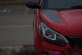 Closeup shot of a modern red car with led and xenon optics Royalty Free Stock Photo