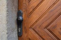 Closeup shot of modern wood door with a round metal handle. Copy space Royalty Free Stock Photo