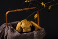 Closeup shot of mooncakes on a basket for Mid-Autumn Festival isolated on black background