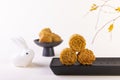 Closeup shot of mooncakes on a black plate for Mid-Autumn Festival isolated on white background