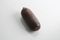 Closeup shot of a morcilla sausage isolated on a white background