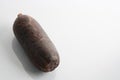 Closeup shot of morcilla sausage on a white background