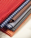 Closeup shot of multicolored white striped fabrics on a white background Royalty Free Stock Photo