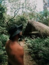 Closeup shot of a muscular male standing in the jungle in Cap Cana, Dominican Republic