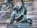 Closeup shot of a mythological creature's fountain statue in France