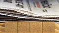 Closeup shot of newspapers on a wooden table