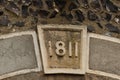 Closeup shot of the number 1811 in keystone on the arched door Royalty Free Stock Photo