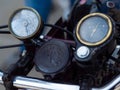 Closeup shot of the odometer and speedometer of a vintage motorbike