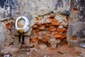 Closeup Shot Of An Old Brick Wall With Dirty Urinal