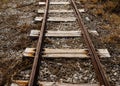 Closeup shot of old broken wooden train tracks on the floor Royalty Free Stock Photo