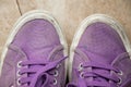 Closeup shot of old dirty purple sneakers