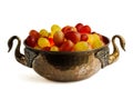 Closeup shot of an old fruit bowl with red and green grapes in it, on a white background Royalty Free Stock Photo