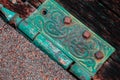 Closeup shot of an old metal rusty hinge of a wooden door