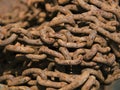 Closeup shot of old piled rusty chains Royalty Free Stock Photo