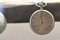 Closeup shot of an old pocket metal watch on a blurred background Royalty Free Stock Photo