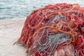 Closeup shot of old red fishing nets in Porto Cesareo, Italy Royalty Free Stock Photo