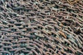 Closeup shot of old rusted chains on the ground