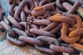 Closeup shot of old rusted chains on the ground Royalty Free Stock Photo