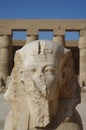 Closeup shot of an old sphinx statue on a blurred background