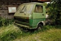 Closeup shot of an old Volkswagen LT car overgrown with moss in Germany in rural surroundings