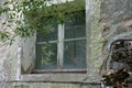 Closeup shot of an old wooden window of an abandoned building