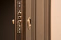 Closeup shot of open door with a lock and a keyhole Royalty Free Stock Photo