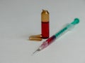 Closeup shot of an open glass ampule and syringe filled with a red liquid and copy space Royalty Free Stock Photo