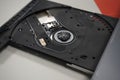 Closeup shot of open optical disc drive on a modern laptop computer without a disc Royalty Free Stock Photo