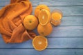 Closeup shot of orange fruits bunch on a wooden surface- fresh-squeezed orange juice concept