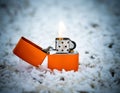 Closeup shot of an orange lit cigarette lighter Royalty Free Stock Photo