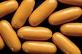 Closeup shot of orange pills near each other - the concept of addiction Royalty Free Stock Photo