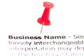 Closeup shot over words Business Name on paper