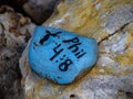 Closeup shot of a painted rock in a garden with a Bible Verse, Philippians 4:8 Royalty Free Stock Photo