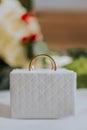 Closeup shot of a pair of gold wedding rings