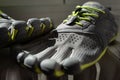 Closeup shot of a pair of gray green toe shoes for sport