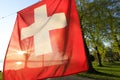 Closeup shot of a partially transparent Switzerland flag