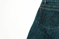 Closeup shot of a patch pocket of blue jeans on white background Royalty Free Stock Photo