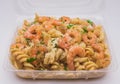 Closeup shot of penne pasta with prawns or shrimps, lemon and garlic