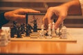 Closeup shot of people playing timed chess