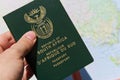Closeup shot of a person holding the passport of the Republic of South Africa Royalty Free Stock Photo