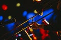 Closeup shot of a person playing the trombone at a concert